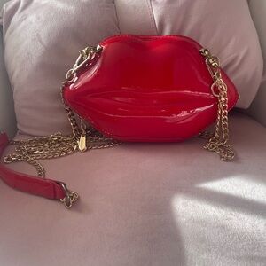 Glossy Red Lip-Shaped Clutch with Gold Chain Strap